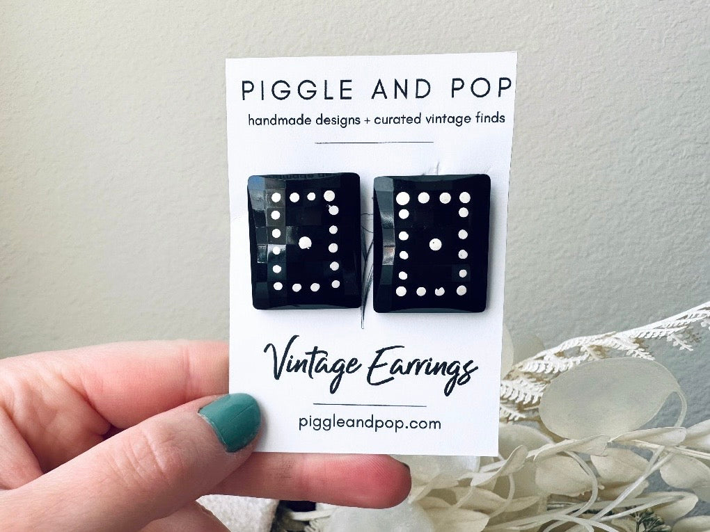 Black Domino Earrings, Vintage West Germany Faceted Black Rectangle Clip Ons with White Polka Dots held in hand