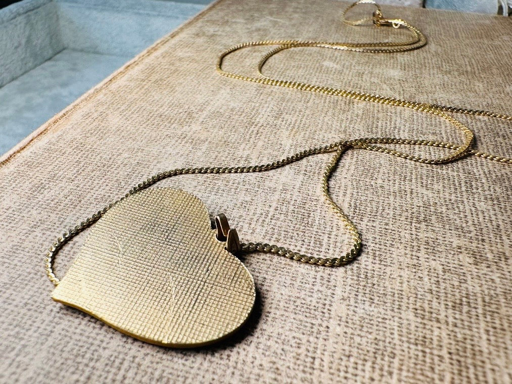 This vintage floral blue heart pendant necklace is so beautiful. Featuring a deep cobalt blue enameled heart pendant on long fine gold tone chain. This vintage blue heart necklace is romantic and whimsical- featuring white flowers trimmed in gold. Great for layering with others. Arrives beautifully[packaged and ready for gift giving.
Dimensions: pendant is 1" x 1.15" chain is 24" long