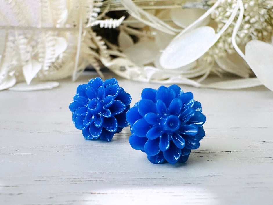 These bright cobalt blue dahlia flower stud earrings are the perfect accent to brighten up your outfit. These handmade glossy resin flower earrings feature hypoallergenic surgical steel posts with butterfly backs- ideal for sensitive ears. These whimsical earrings will arrive beautifully packaged and ready for gift giving (for yourself or another!) at no extra charge.