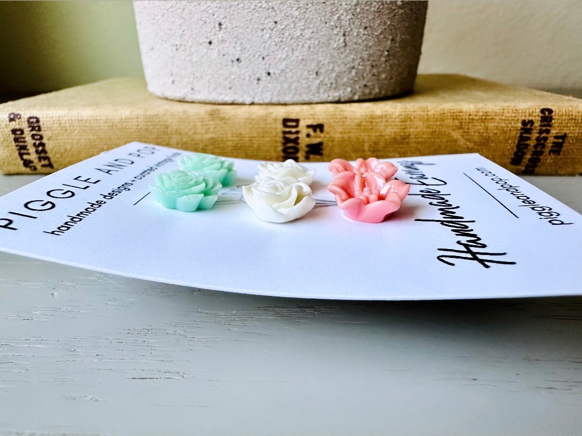 This flower earring set is full of the prettiest colors! Minty green bloomed roses, cream peonies and deep dusty rose lilies- a wonderful set of everyday earrings. These handmade resin flower earrings have hypoallergenic surgical steel posts with butterfly backs making them great for sensitive ears + comfortable all day wear.