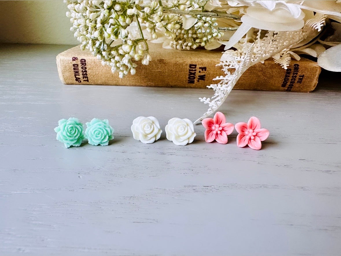 This flower earring set is full of the prettiest colors! Minty green bloomed roses, cream peonies and deep dusty rose lilies- a wonderful set of everyday earrings. These handmade resin flower earrings have hypoallergenic surgical steel posts with butterfly backs making them great for sensitive ears + comfortable all day wear.