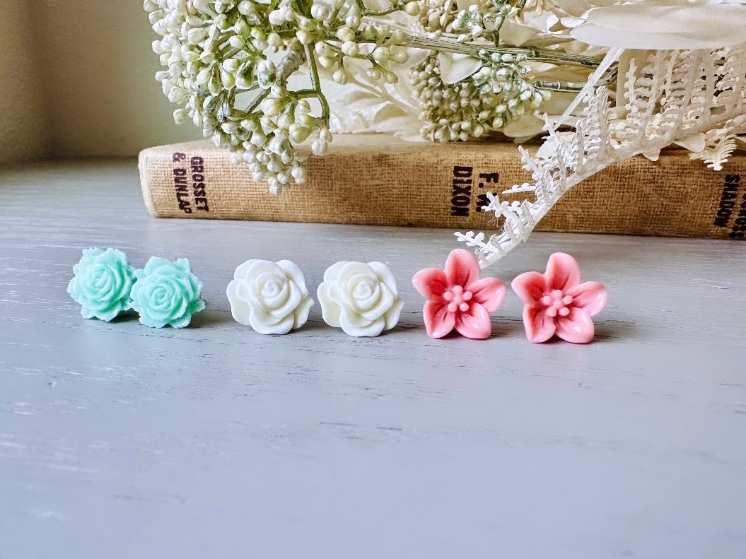 This flower earring set is full of the prettiest colors! Minty green bloomed roses, cream peonies and deep dusty rose lilies- a wonderful set of everyday earrings. These handmade resin flower earrings have hypoallergenic surgical steel posts with butterfly backs making them great for sensitive ears + comfortable all day wear.