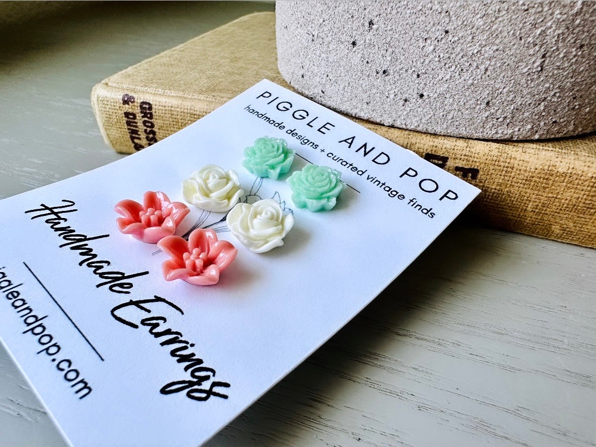 This flower earring set is full of the prettiest colors! Minty green bloomed roses, cream peonies and deep dusty rose lilies- a wonderful set of everyday earrings. These handmade resin flower earrings have hypoallergenic surgical steel posts with butterfly backs making them great for sensitive ears + comfortable all day wear.
