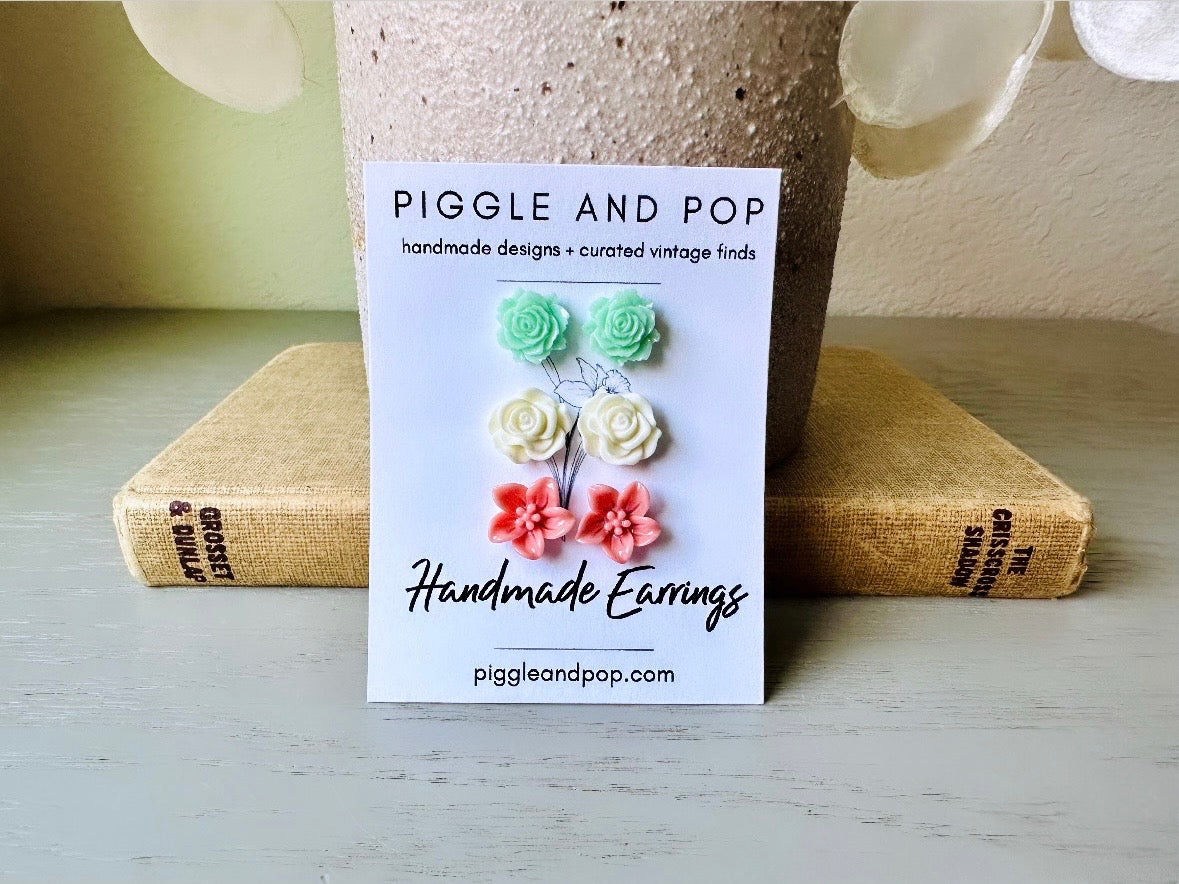 This flower earring set is full of the prettiest colors! Minty green bloomed roses, cream peonies and deep dusty rose lilies- a wonderful set of everyday earrings. These handmade resin flower earrings have hypoallergenic surgical steel posts with butterfly backs making them great for sensitive ears + comfortable all day wear.