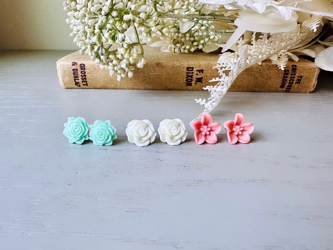 This flower earring set is full of the prettiest colors! Minty green bloomed roses, cream peonies and deep dusty rose lilies- a wonderful set of everyday earrings. These handmade resin flower earrings have hypoallergenic surgical steel posts with butterfly backs making them great for sensitive ears + comfortable all day wear.