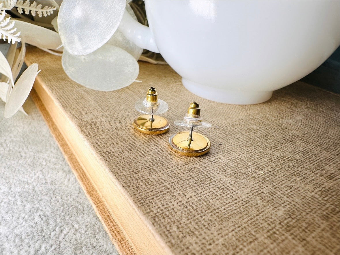 Small decorative items on a textured surface with a blurred background
