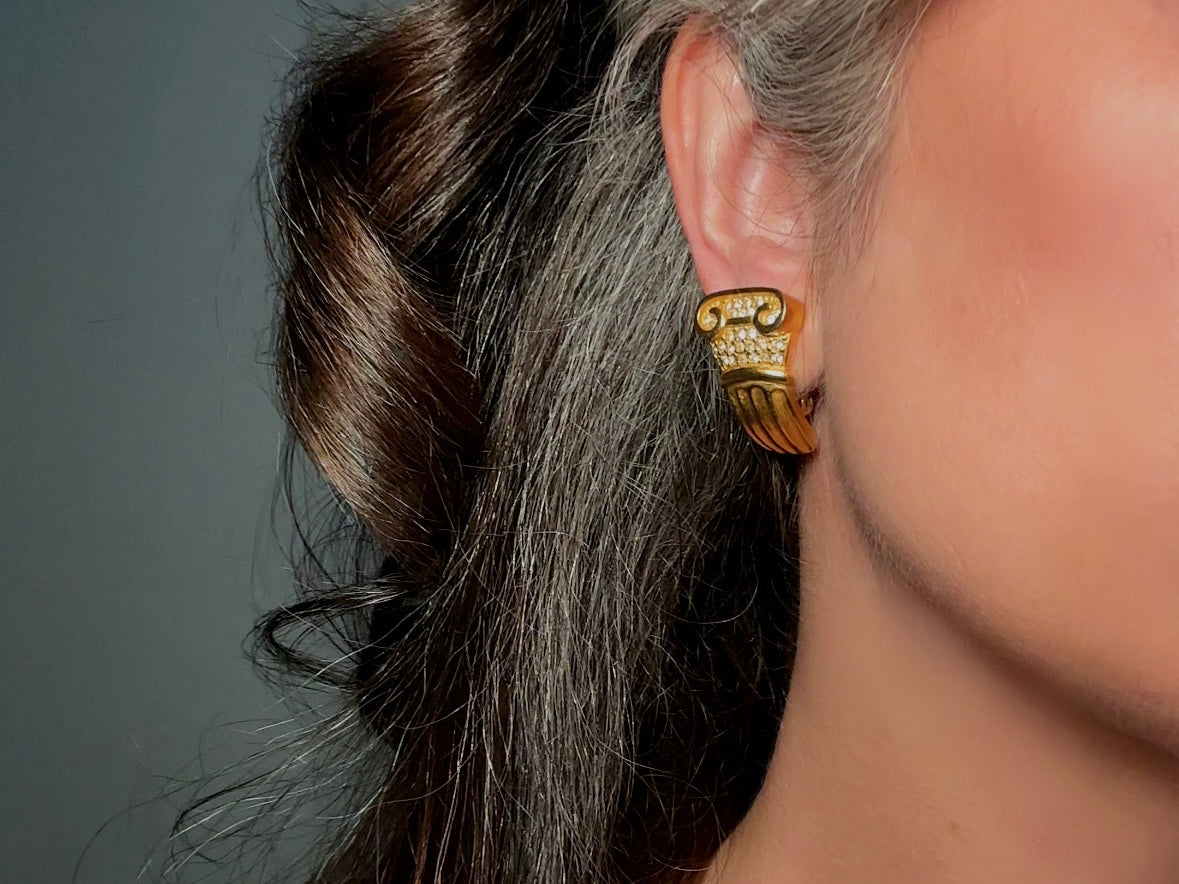 These vintage gold Carolee Roman column earrings are an incredible pair of bold neoclassical earrings. Featuring a matte gold finish, these clip on style sculptural earrings are accented with tiny pave set rhinestones. An incredible pair of signed designer earrings from the 1980s. A truly striking vintage treasure. Please view all pics and let me know if you have any questions at all!