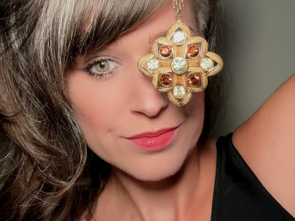This 1970s vintage gold maltese cross pendant necklace is absolutely stunning! Featuring shimmering crystals in topaz and citrine set in a textured gold Etruscan pendant. This large bold vintage pendant is suspended from its original double link gold rolo chain, that fastens with a spring ring clasp. Signed SC from 1975.