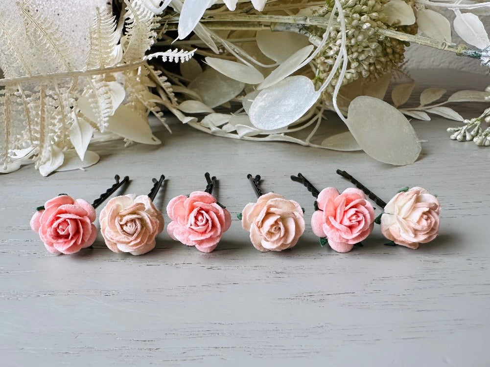 These sweet pink two tone rose paper flower hair pins will add a touch of rustic whimsy to your favorite hair styles. This handmade set includes 6 miniature mulberry paper roses in a light peachy pink and cotton candy pink wire wrapped around salon quality "no slip" bobby pins, three of each color. These pins are ideal for your wedding, celebrations, and any day you feel like making a little special.