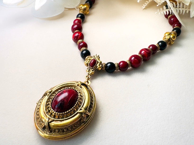 Vintage 1928 Jewelry Co. Ornate Gold-Tone & Marbled Red Cabochon Locket Statement Necklace