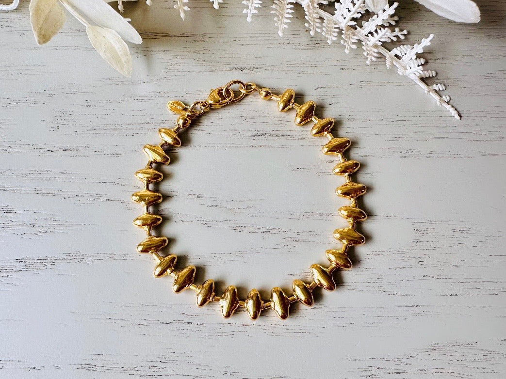 1970s Gold Signed Monet Vintage Designer Sawtooth Bracelet from Piggle and Pop