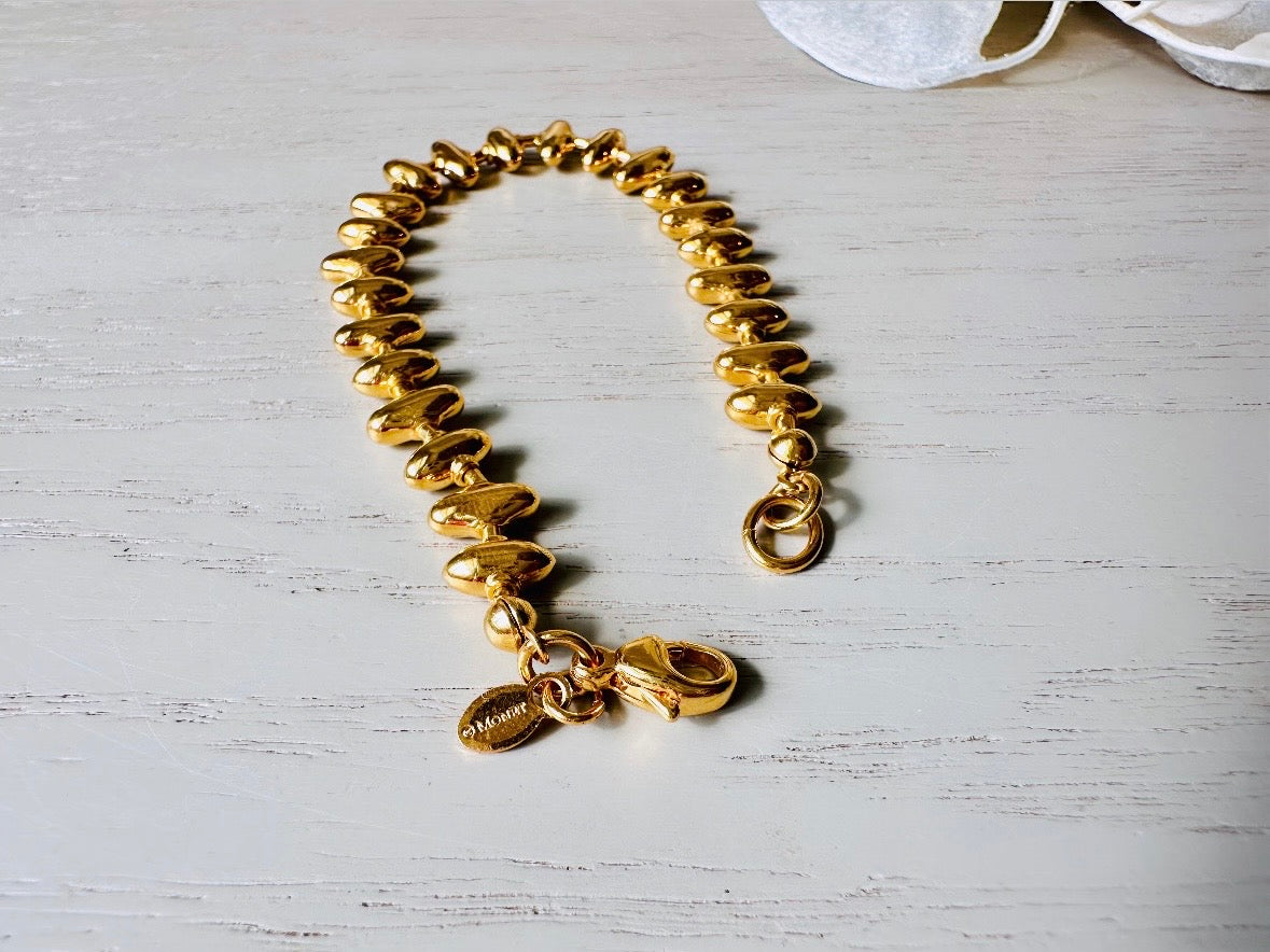 1970s Gold Signed Monet Vintage Designer Sawtooth Bracelet beaded 