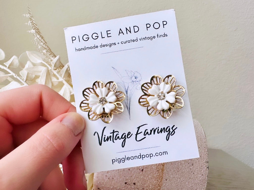 Gold Filigree Flower Earrings, 1960s Vintage Earrings, White and Gold Bridal Clip On Earrings, White Acrylic Petals with Rhinestone Centers