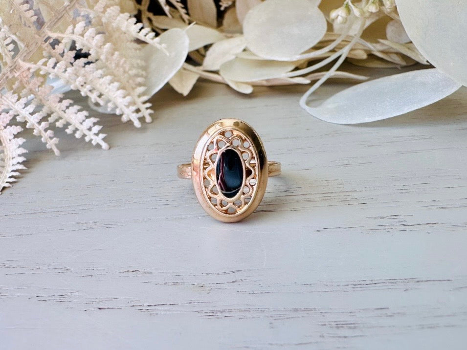 Vintage 1970s Ring, Black and Gold 1979 Sarah Coventry Jet Filigree Ring, Shiny Gold Filigree Oval Ring with Faux Onyx Enamel Center, Size 7