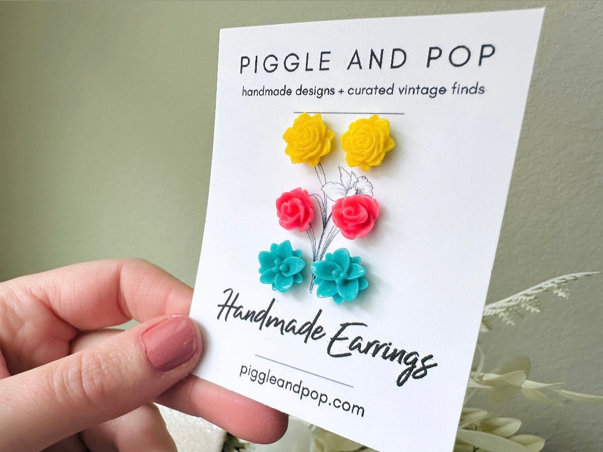 Colorful Flower Earring Set, Yellow Pink Teal Rose Post Earrings in hand