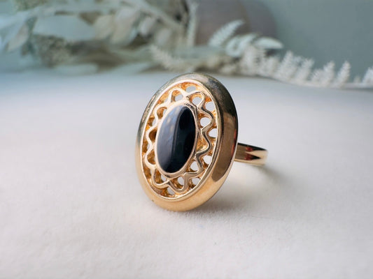 Vintage 1970s Ring, Black and Gold 1979 Sarah Coventry Jet Filigree Ring, Shiny Gold Filigree Oval Ring with Faux Onyx Enamel Center, Size 7