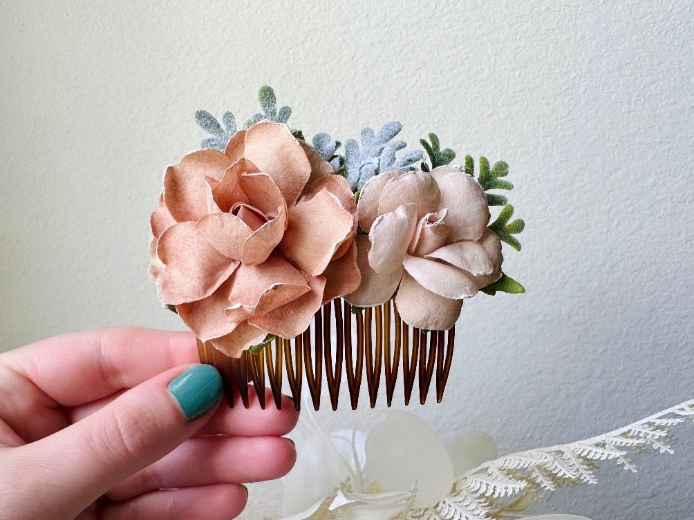 Flower Hair Comb, Handmade Bridal Hair Comb, Ethereal Cream and Sage Green Woodland Boho Hair Flowers by Piggle and Pop held in hand