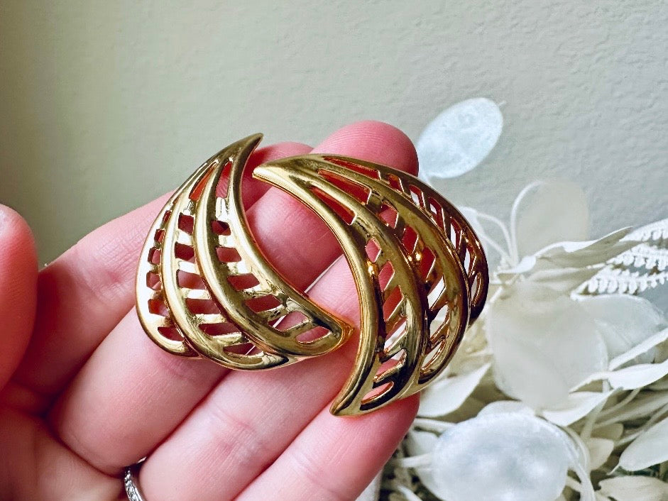 Gold Napier Designer Vintage Pierced 80s Fan Earrings held in hand 