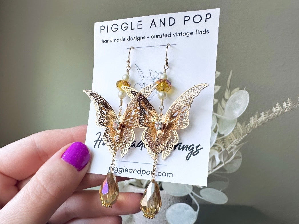 Handmade Golden Butterfly Earrings, 14kt Gold Crystal and Pearl Faerie Wedding Earrings from Piggle and Pop Original close up card display