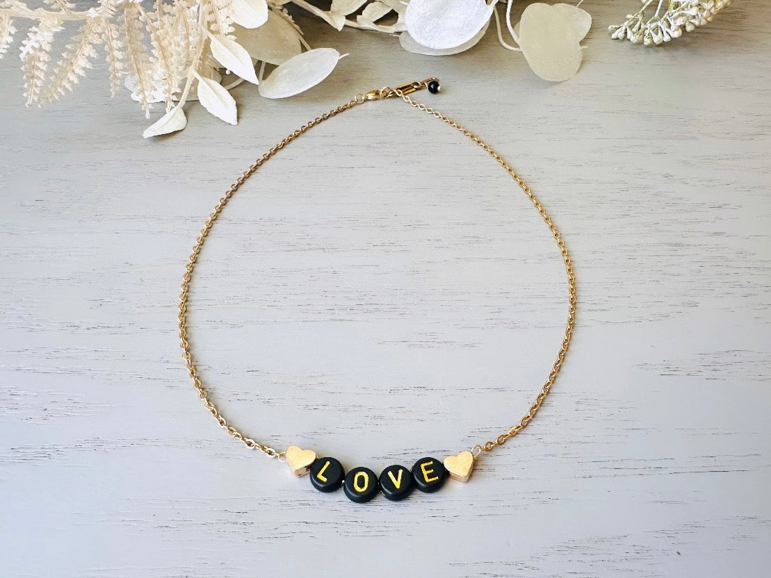 Handmade Love Beaded Necklace, 18k Chain Black and Gold Heart  top view