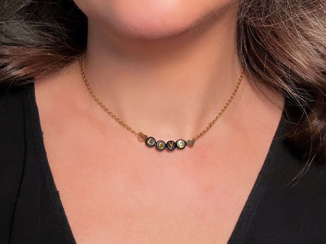 Handmade Love Beaded Necklace, 18k Chain Black and Gold Heart  modelled by Bethan Jayne 