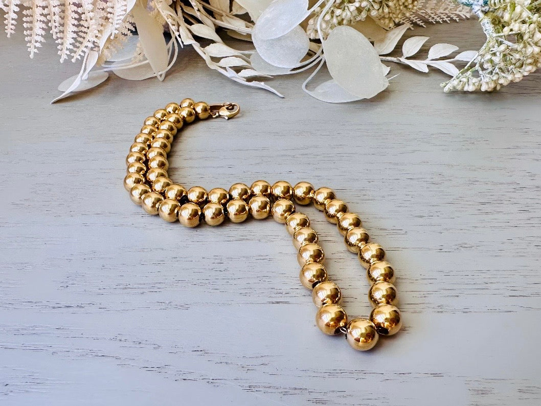 close up of Napier Shiny Gold Ball Chain Choker Vintage Designer Necklace