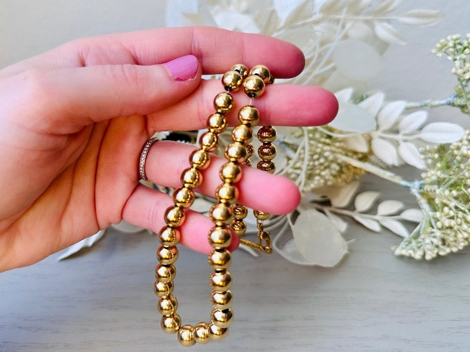 held in hand Napier Shiny Gold Ball Chain Choker Vintage Designer Necklace