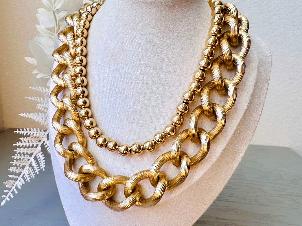 Napier Shiny Gold Ball Chain Choker Vintage Designer Necklace paired with others on mannequin