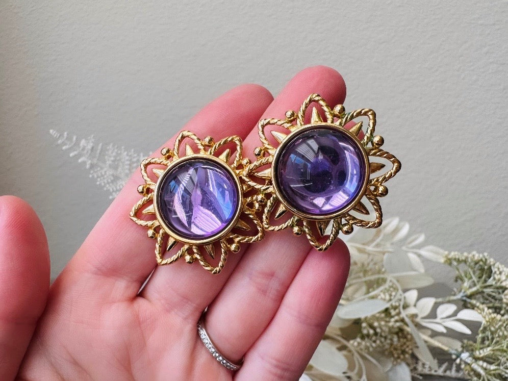  designer Purple Trifari Jelly Belly Sun Earrings, Rare Moonglow Violet Domed Glass Earrings in hand 