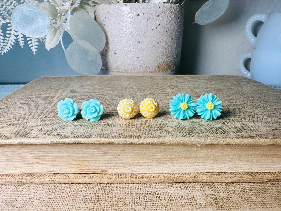 This mint and yellow flower earring set features a summery color combination and unique floral shapes. Cool mint roses, vintage yellow daisy studs with a white floral inlay and turquoise + yellow gerber daisies are paired up in a beautifully colorful set. These handmade resin earrings feature hypoallergenic surgical steel posts (ideal for sensitive ears!). 