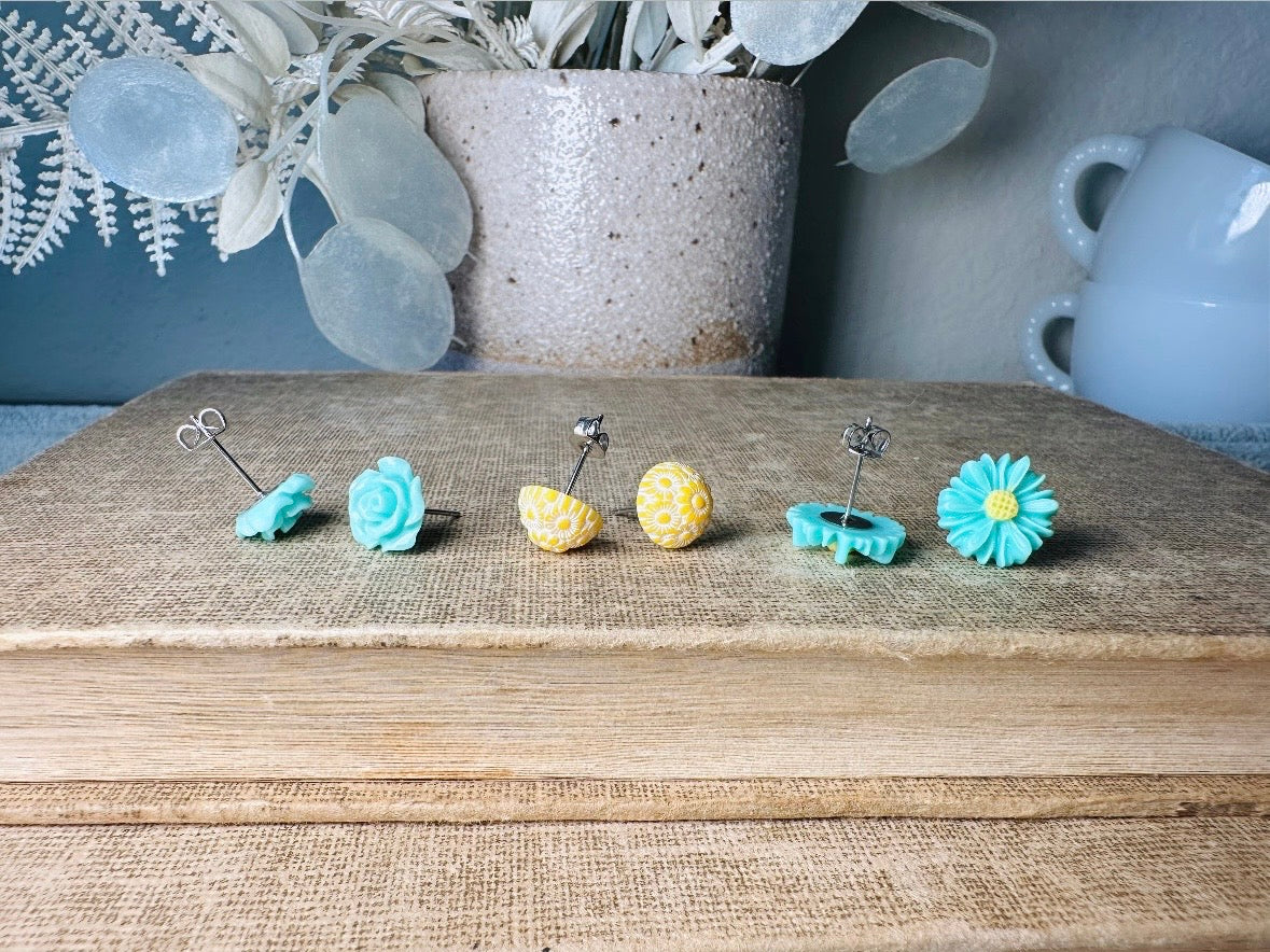 This mint and yellow flower earring set features a summery color combination and unique floral shapes. Cool mint roses, vintage yellow daisy studs with a white floral inlay and turquoise + yellow gerber daisies are paired up in a beautifully colorful set. These handmade resin earrings feature hypoallergenic surgical steel posts (ideal for sensitive ears!). 