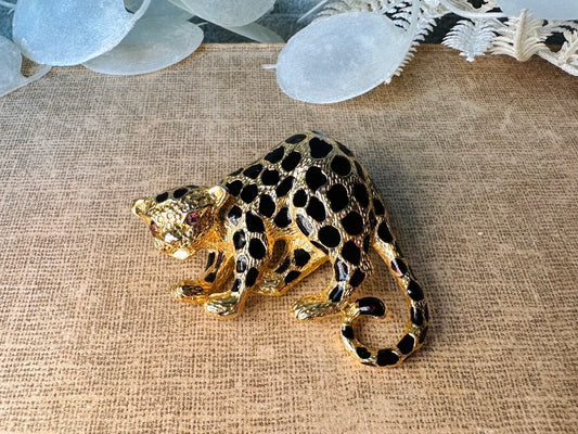 This vintage black and gold spotted leopard brooch is incredible. It is not only a striking statement brooch but easily converts to a pendant with a built in bail- add it to your favorite chain for to transform into a pendant necklace. Signed Park Lane piece in excellent vintage condition, with minimal wear. Incredibly detailed and a wonderful size. Please view all pics and let me know if you have any questions at all.

Dimensions: approximately 2.25". x 1.5"&nbsp;