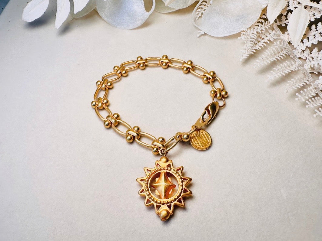 Vintage Anne Klein Bracelet, Matte Gold Link Charm Bracelet with Celestial Sun Pendant and Coin, Etruscan Chunky Gold Chain Bracelet