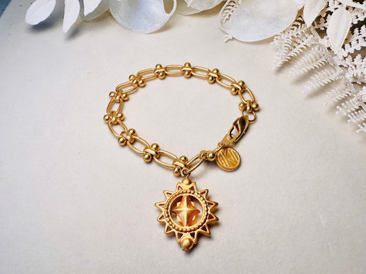 Vintage Anne Klein Bracelet, Matte Gold Link Charm Bracelet with Celestial Sun Pendant and Coin, Etruscan Chunky Gold Chain Bracelet