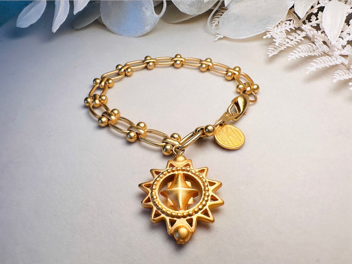 Vintage Anne Klein Bracelet, Matte Gold Link Charm Bracelet with Celestial Sun Pendant and Coin, Etruscan Chunky Gold Chain Bracelet