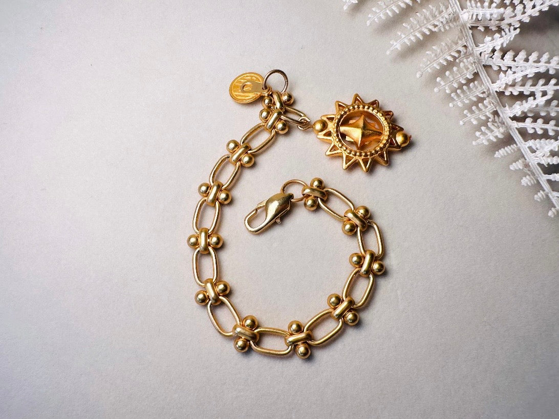 Vintage Anne Klein Bracelet, Matte Gold Link Charm Bracelet with Celestial Sun Pendant and Coin, Etruscan Chunky Gold Chain Bracelet