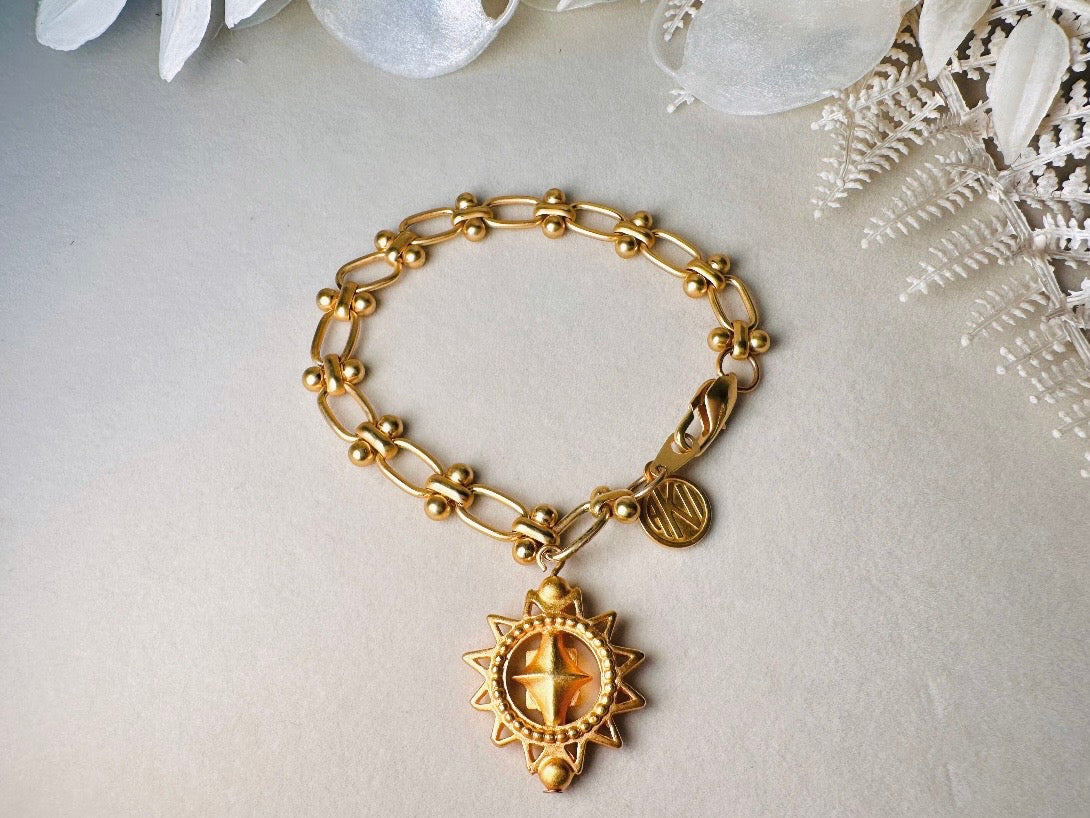 Vintage Anne Klein Bracelet, Matte Gold Link Charm Bracelet with Celestial Sun Pendant and Coin, Etruscan Chunky Gold Chain Bracelet