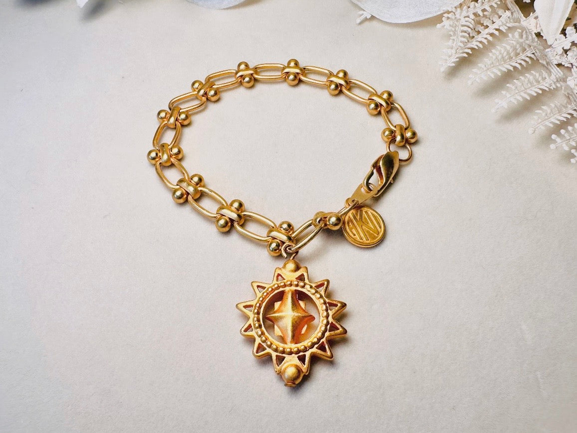 Vintage Anne Klein Bracelet, Matte Gold Link Charm Bracelet with Celestial Sun Pendant and Coin, Etruscan Chunky Gold Chain Bracelet