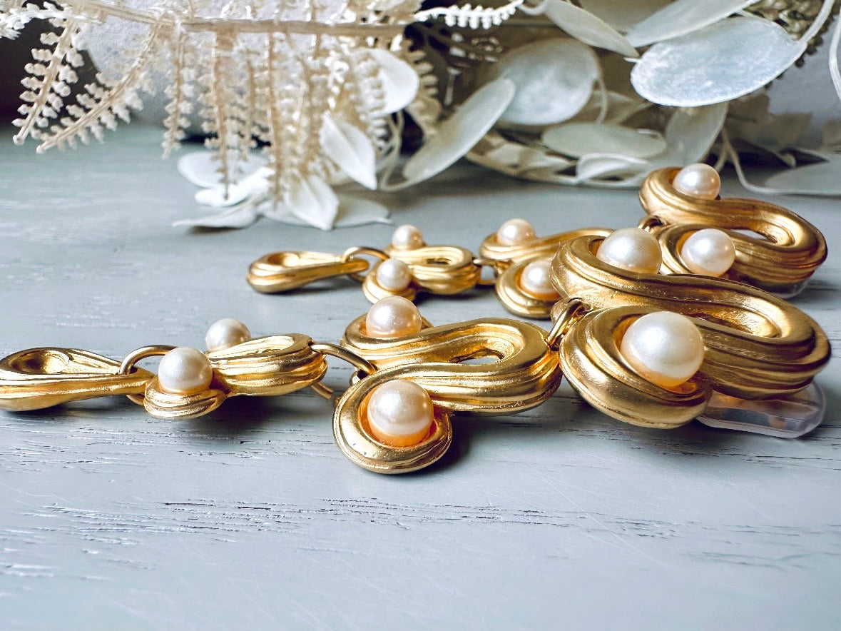 close up side Vintage Blanca Designer Pearl Drop Oversized Matte Gold Clip On Earrings