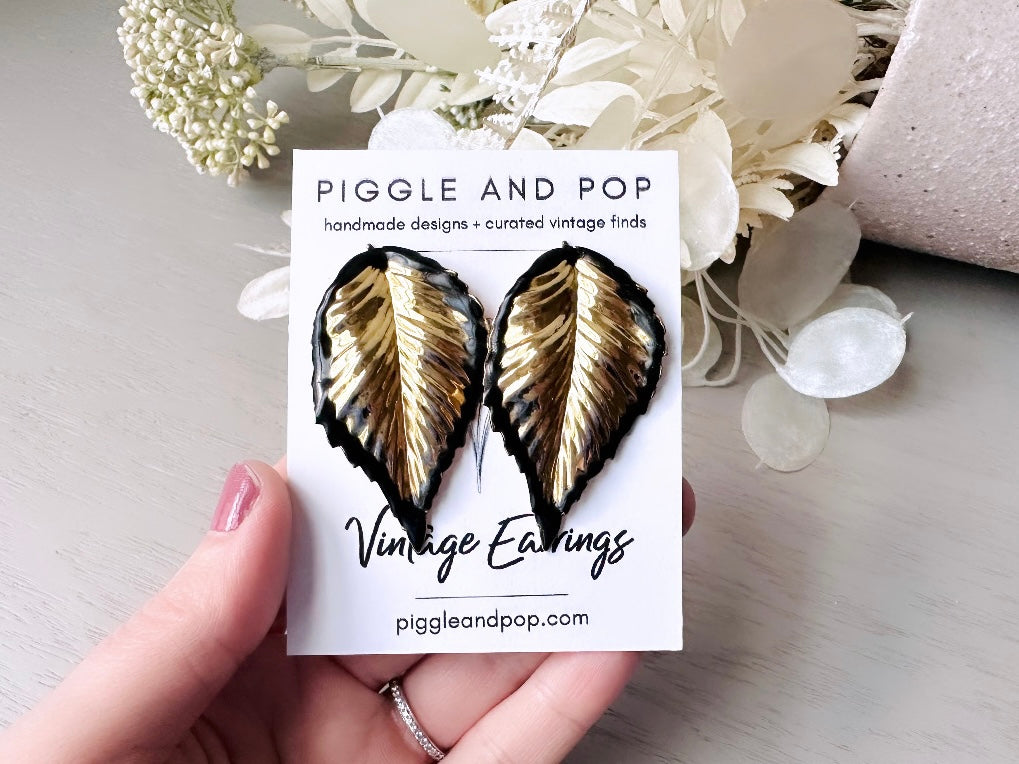 Vintage Gold Leaf Earrings with Black Enamel Tips, Gold Leaves Clip On Earrings, 1980s Statement Earring, Whimsical Clip-Ons for Non-Pierced from Piggle and Pop