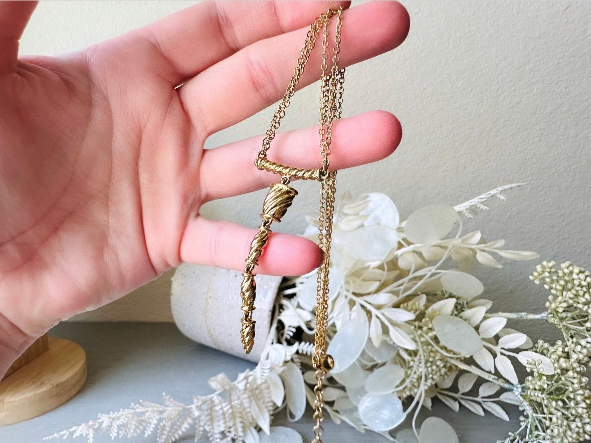 Vintage Napier Necklace, Sleek Gold Y Pendant Drop Necklace from Piggle and Pop held in hand