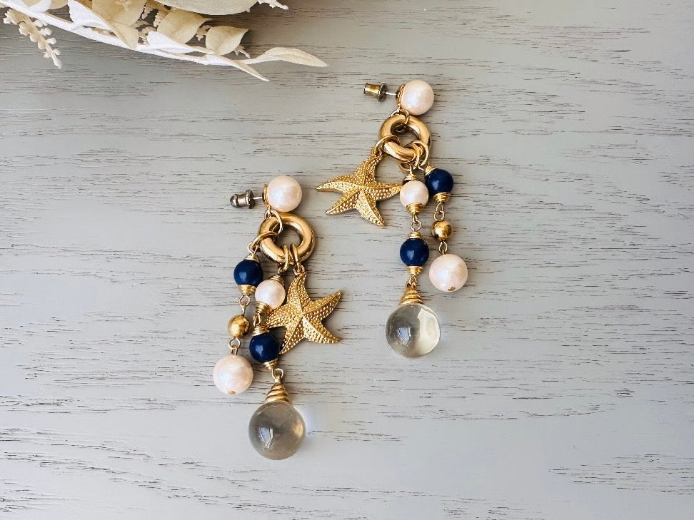 Vintage Starfish Earrings, Cascading Charm Earrings with Pools of Light Quartz Orbs, Navy and Cream Pearls laid flat