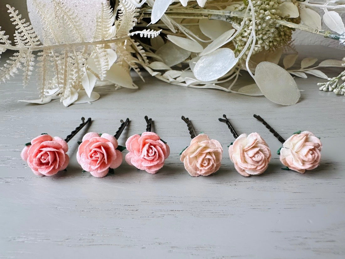 These sweet pink two tone rose paper flower hair pins will add a touch of rustic whimsy to your favorite hair styles. This handmade set includes 6 miniature mulberry paper roses in a light peachy pink and cotton candy pink wire wrapped around salon quality "no slip" bobby pins, three of each color. These pins are ideal for your wedding, celebrations, and any day you feel like making a little special. Custom color requests are warmly welcomed- just shoot me a message.
