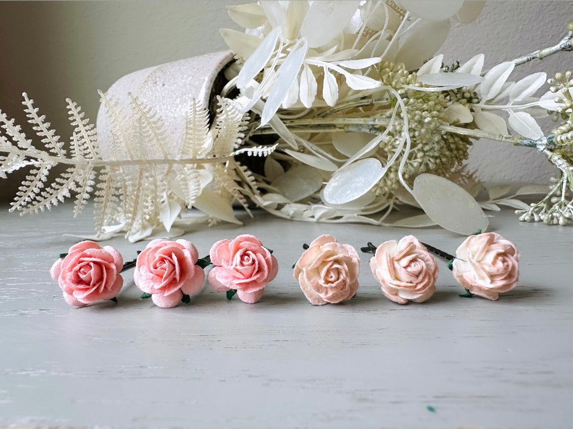 These sweet pink two tone rose paper flower hair pins will add a touch of rustic whimsy to your favorite hair styles. This handmade set includes 6 miniature mulberry paper roses in a light peachy pink and cotton candy pink wire wrapped around salon quality "no slip" bobby pins, three of each color. These pins are ideal for your wedding, celebrations, and any day you feel like making a little special. 
