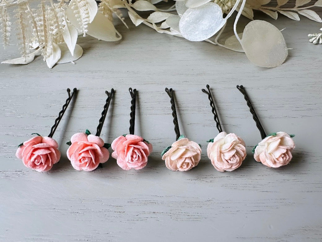 These sweet pink two tone rose paper flower hair pins will add a touch of rustic whimsy to your favorite hair styles. This handmade set includes 6 miniature mulberry paper roses in a light peachy pink and cotton candy pink wire wrapped around salon quality "no slip" bobby pins, three of each color. These pins are ideal for your wedding, celebrations, and any day you feel like making a little special. 