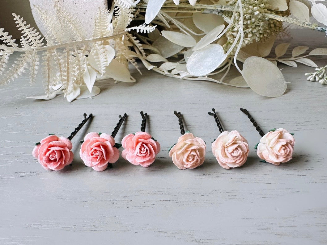 These sweet pink two tone rose paper flower hair pins will add a touch of rustic whimsy to your favorite hair styles. This handmade set includes 6 miniature mulberry paper roses in a light peachy pink and cotton candy pink wire wrapped around salon quality "no slip" bobby pins, three of each color. These pins are ideal for your wedding, celebrations, and any day you feel like making a little special. 