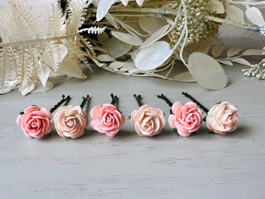 These sweet pink two tone rose paper flower hair pins will add a touch of rustic whimsy to your favorite hair styles. This handmade set includes 6 miniature mulberry paper roses in a light peachy pink and cotton candy pink wire wrapped around salon quality "no slip" bobby pins, three of each color. These pins are ideal for your wedding, celebrations, and any day you feel like making a little special. 