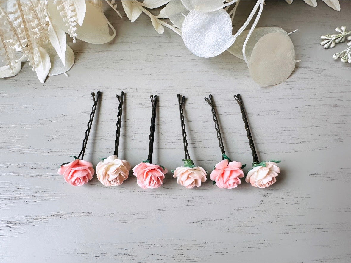 These sweet pink two tone rose paper flower hair pins will add a touch of rustic whimsy to your favorite hair styles. This handmade set includes 6 miniature mulberry paper roses in a light peachy pink and cotton candy pink wire wrapped around salon quality "no slip" bobby pins, three of each color. These pins are ideal for your wedding, celebrations, and any day you feel like making a little special. 