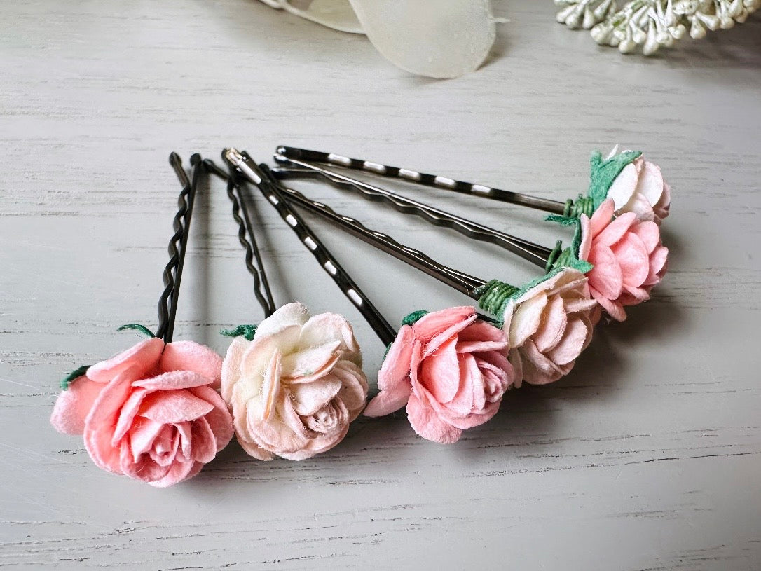 These sweet pink two tone rose paper flower hair pins will add a touch of rustic whimsy to your favorite hair styles. This handmade set includes 6 miniature mulberry paper roses in a light peachy pink and cotton candy pink wire wrapped around salon quality "no slip" bobby pins, three of each color. These pins are ideal for your wedding, celebrations, and any day you feel like making a little special. 