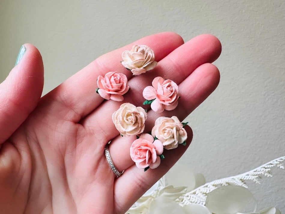 These sweet pink two tone rose paper flower hair pins will add a touch of rustic whimsy to your favorite hair styles. This handmade set includes 6 miniature mulberry paper roses in a light peachy pink and cotton candy pink wire wrapped around salon quality "no slip" bobby pins, three of each color. These pins are ideal for your wedding, celebrations, and any day you feel like making a little special. 